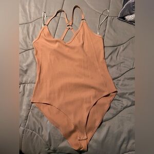 Pink nude body suit